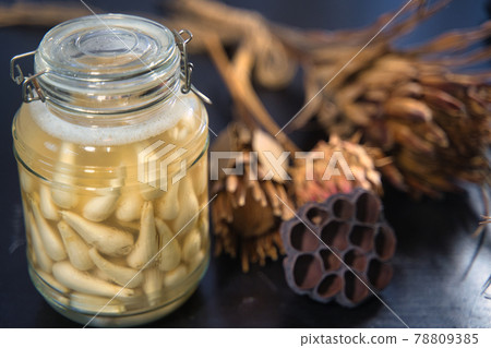Pickled scallions in a bottle 78809385