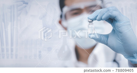 Doctor or scientist with a stethoscope holding COVID-19 vaccine, measles, coronavirus vaccine shot for diseases outbreak vaccination, vaccine Concept fight against virus covid-19 corona virus 78809405