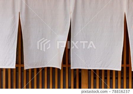 Lattice door at the entrance of a Japanese restaurant and plain white curtain Lattice door at the entrance of a Japanese restaurant and plain white curtain 78816237