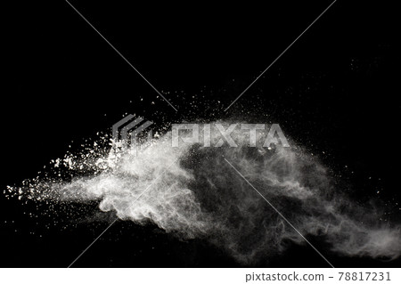 White powder explosion isolated on black background. White dust particles splash.Color Holi Festival. White powder explosion isolated on black background. White dust particles splash.Color Holi Festival. 78817231