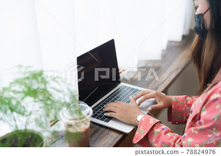 Female graphic designer artist using laptop working in windowsill at the cafe Female graphic designer artist using laptop working in windowsill at the cafe 78824976