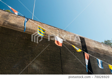 Nautical flags on the ship in the lock 78826920