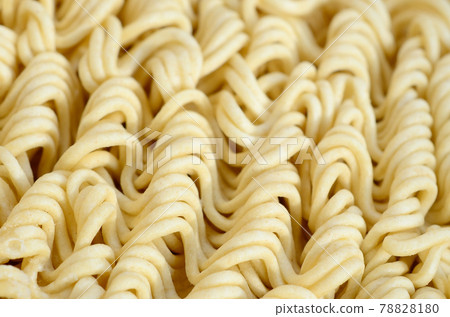 Close up view of yellow dry instant noodles. Chinese traditional food Close up view of yellow dry instant noodles. Chinese traditional food 78828180