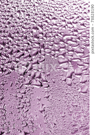 Texture of a drop of rain on a glass wet transparent background. Toned in pink color 78828190