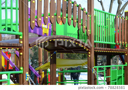Fragment of a playground made of plastic and wood, painted in different colors 78828381