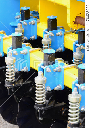 Spring system of agricultural seeder close up Spring system of agricultural seeder close up 78828953