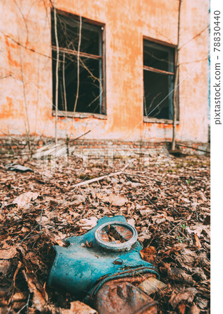 Gasmask Near Abandoned Ruined Old Village School Building In Chernobyl Resettlement Zone. Belarus. Chornobyl Catastrophe Disasters. Dilapidated House In Belarusian Village. Whole Villages Must Be 78830440