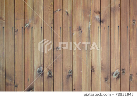 Close up of brown wooden fence panels. Many vertical wooden planks 78831945