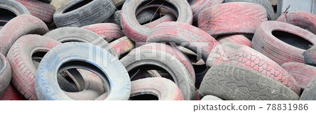 A picture of many old used tires left on a waste dump A picture of many old used tires left on a waste dump 78831986