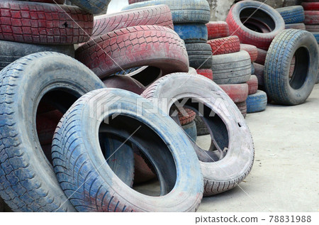 A picture of many old used tires left on a waste dump A picture of many old used tires left on a waste dump 78831988