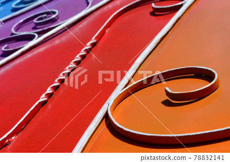 Metal texture of a piece of colored wall with a forged pattern Metal texture of a piece of colored wall with a forged pattern 78832141
