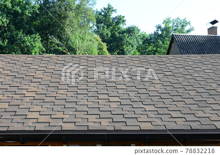 Modern roofing and decoration of chimneys. Flexible bitumen or slate shingles 78832218