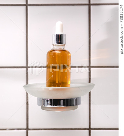 Natural Serum. Concept of cosmetic injection is hyaluronic acid, botulin, serum on the background of tiles in the bathroom 78833174