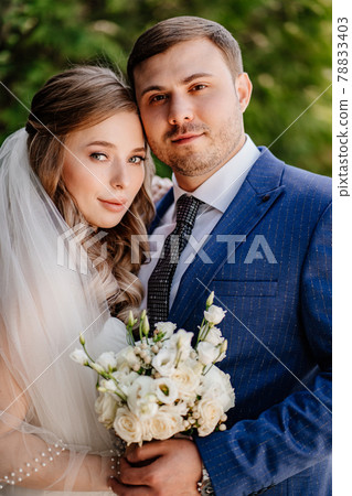 portrait of the bride and groom. beautiful and romantic newlyweds.  78833403