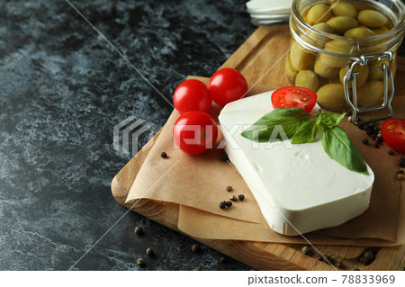 Concept of tasty food with feta cheese on black smokey background 78833969