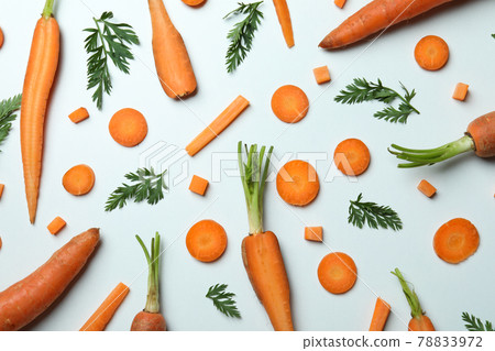 Carrots, slices and leaves of carrot on white background Carrots, slices and leaves of carrot on white background 78833972