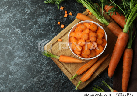 Concept of fresh vegetable with carrot on black smokey table Concept of fresh vegetable with carrot on black smokey table 78833973