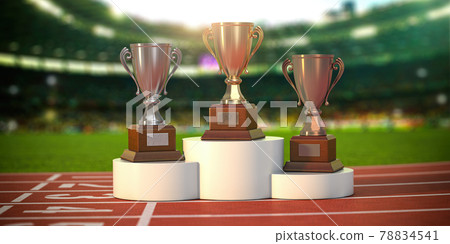 Sport trophy cups on pedestal at the stadium. Competition, championship winners reward. 78834541