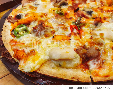 Close up cheese pizza on wooden pan for appetizer dish meal Close up cheese pizza on wooden pan for appetizer dish meal 78834609
