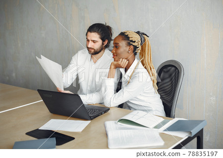 Mixed businesspeople working at the office Mixed businesspeople working at the office 78835197