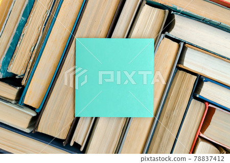 A pattern of old books with a top view. Solid background with copy space. 78837412
