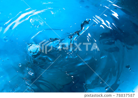 Drop of water. Blue water drop. Falling water. Water splash close-up. Rain close up 78837587