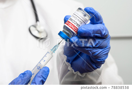 COVID-19 vaccine in doctor hands close-up COVID-19 vaccine in doctor hands close-up 78838538
