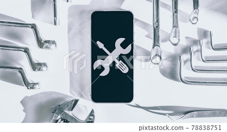 Mobile repair service. Technician workplace with phone and special repairing tools. Electronics repair service, device production concept. Mobile repair service. Technician workplace with phone and special repairing tools. Electronics repair service, device production concept. 78838751