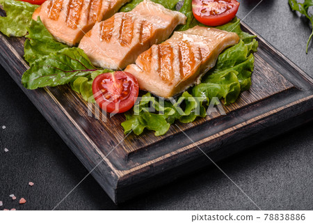 Delicious fresh salad with fish, tomatoes and lettuce leaves Delicious fresh salad with fish, tomatoes and lettuce leaves 78838886