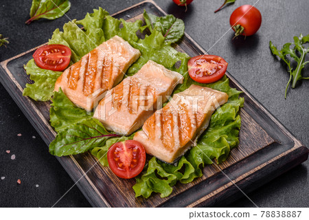 Delicious fresh salad with fish, tomatoes and lettuce leaves Delicious fresh salad with fish, tomatoes and lettuce leaves 78838887