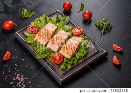 Delicious fresh salad with fish, tomatoes and lettuce leaves 78838888