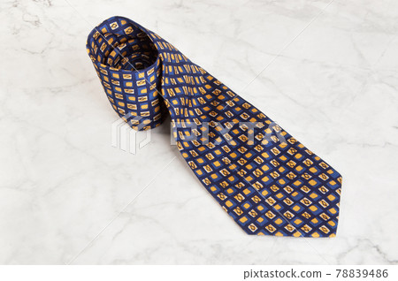 Blue tie with geometric pattern Blue tie with geometric pattern 78839486