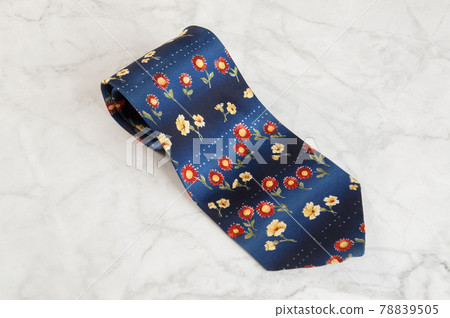 Blue tie with floral pattern Blue tie with floral pattern 78839505