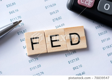 FED word with calculator on desk FED word with calculator on desk 78839547