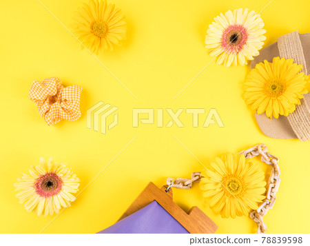 Summer fashion lady shopping concept with straw sandals, purple bag, flowers on yellow background Summer fashion lady shopping concept with straw sandals, purple bag, flowers on yellow background 78839598