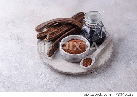 Carob pods, powder and molasses or syrup 78840122