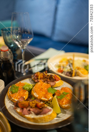 delicious dishes on the table in the restaurant. serving table. sharpness in the middle of the table. delicious dishes on the table in the restaurant. serving table. sharpness in the middle of the table. 78842383
