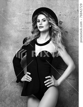 Balck and white. Young blonde curly woman with 78842729