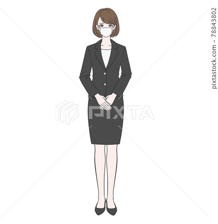 Woman in a suit standing with a mask 78843802