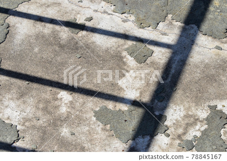 Rough concrete surface and shadow of fence Rough concrete surface and shadow of fence 78845167