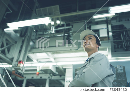 Technicians working in production / factory 78845480