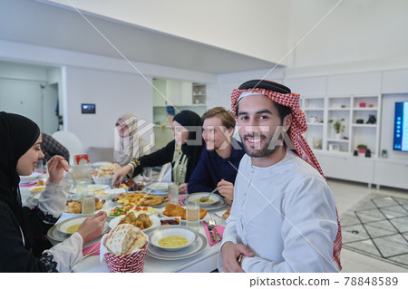 Muslim family having iftar together during Ramadan. 78848589