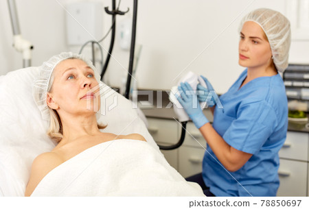 Senior woman waiting for cosmetic procedure in clinic of esthetic cosmetology 78850697