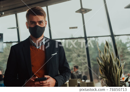 business man wearing protective face mask at office business man wearing protective face mask at office 78850713