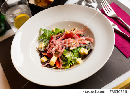 Parisian salad from greens with champignons, ham and emmental 78850716
