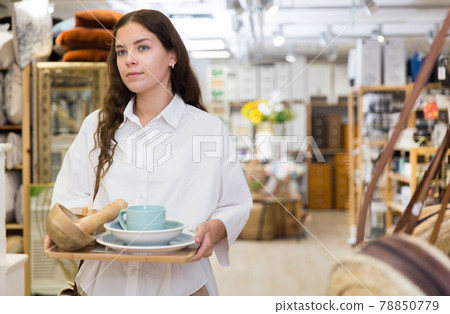 Woman shopping at store of household goods 78850779