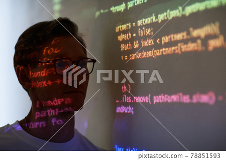 Man reading computer code Man reading computer code 78851593