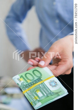 Business Woman Displaying a Spread of Cash euros. Income and Business concept. Venality, bribe, corruption concept. Hand giving money. Millennial candid authentic female hands counting money Business Woman Displaying a Spread of Cash euros. Income and Business concept. Venality, bribe, corruption concept. Hand giving money. Millennial candid authentic female hands counting money 78851709