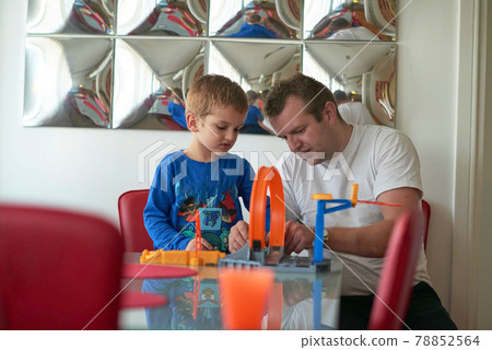 Father and children playing car toy game 78852564