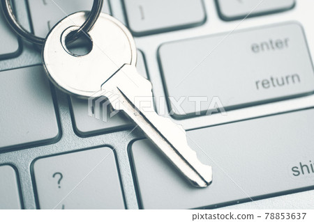 The concept of a strong password from the system. The key on the white keyboard. Toned The concept of a strong password from the system. The key on the white keyboard. Toned 78853637